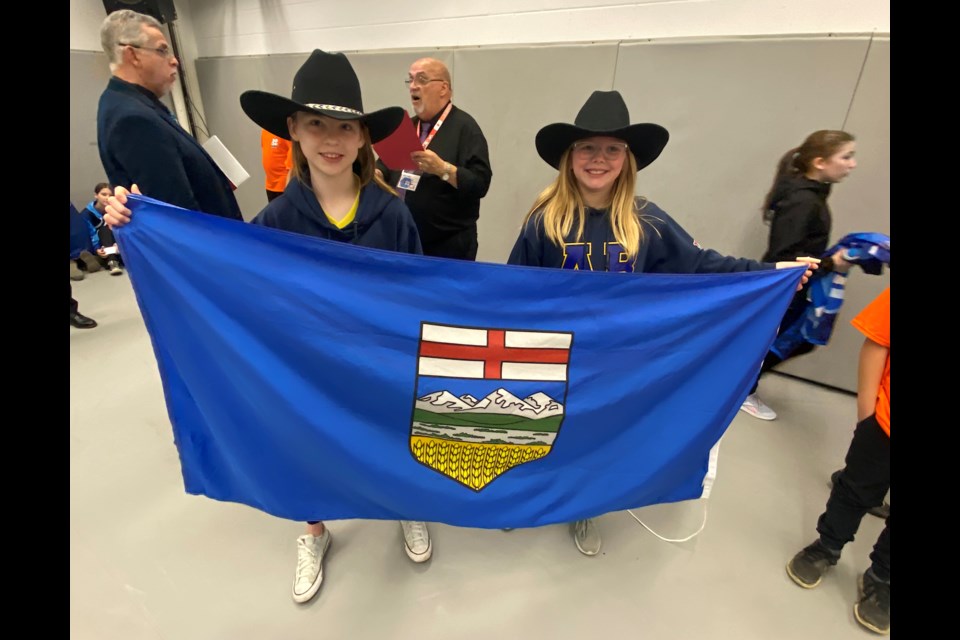 The Millennium Lanes youth bowling team featuring Elizabeth Honish, coach Kyle Honish and Elyssa de Boer won silver in bantam girls doubles at the Youth Bowl Canada Fivepin National Championships on May 8 in Ottawa and Gatineau. 