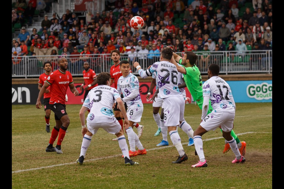 Pacific FC goalkeeper Sean Melvin punches away a cross in the late stages of the 0-0 draw versus Cavalry FC on April 28 at Spruce Meadows' ATCO Field. (Remy Greer/Western Wheel)