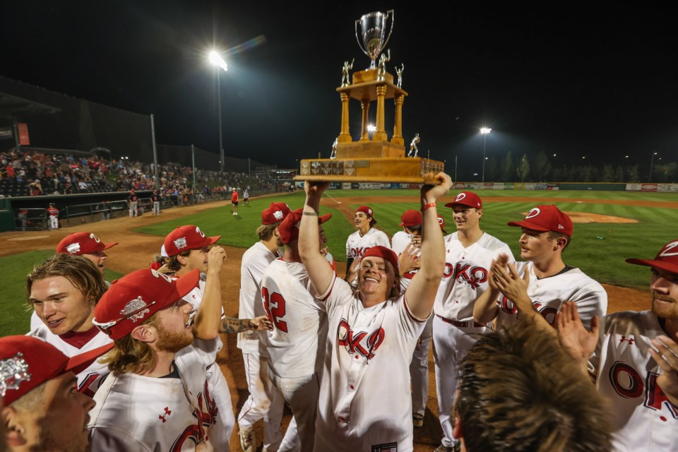 Okotoks Dawgs infielder Connor Crowson lifts the Harry Hallis Memorial Trophy after winning the WCBL Championship on Thursday, Aug. 17 at Seaman Stadium.