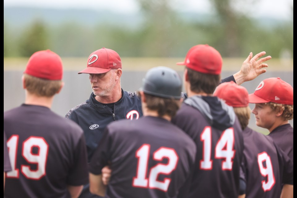 Lou Pote, seen here giving direction to members of the Okotoks Dawgs Academy, was named the interim manager of the Okotoks Dawgs for the 2023 WCBL season with manager Mitch Schmidt away from the team this summer on medical leave.  (Brent Calver/Western Wheel File Photo)