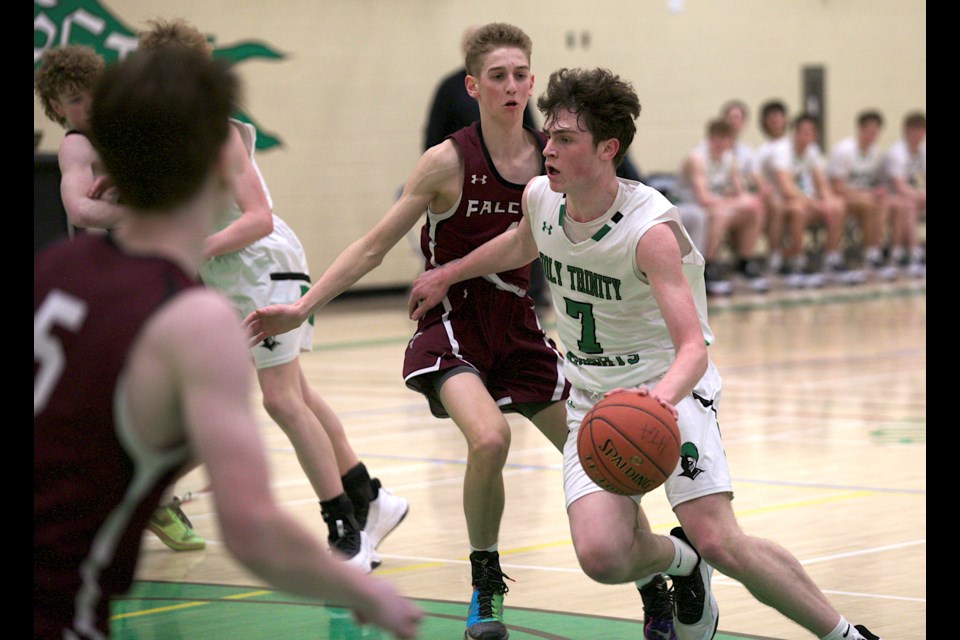 Holy Trinity Academy Knights guard Lucas Barlow drives the lane with Foothills Falcon Nash Byam defending during the Knights Classic senior boys basketball final on Jan. 20 at the HTA gym. The Knights won 86-74 with Barlow taking home tournament MVP honours.