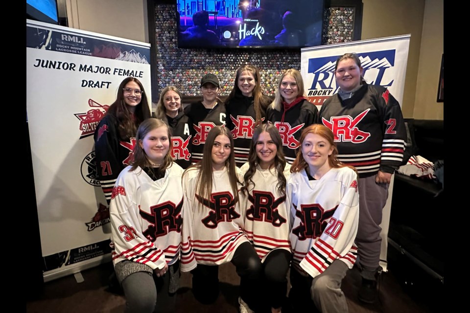 Okotokians Lexi Ballance and Brooklynn Carson, front row second and third from left, were selected by the hometown Okotoks Ladies Raiders in the first Alberta Major Female draft in league history on Feb. 4 at the Canadian Brewhouse in Okotoks. (Photo submitted)