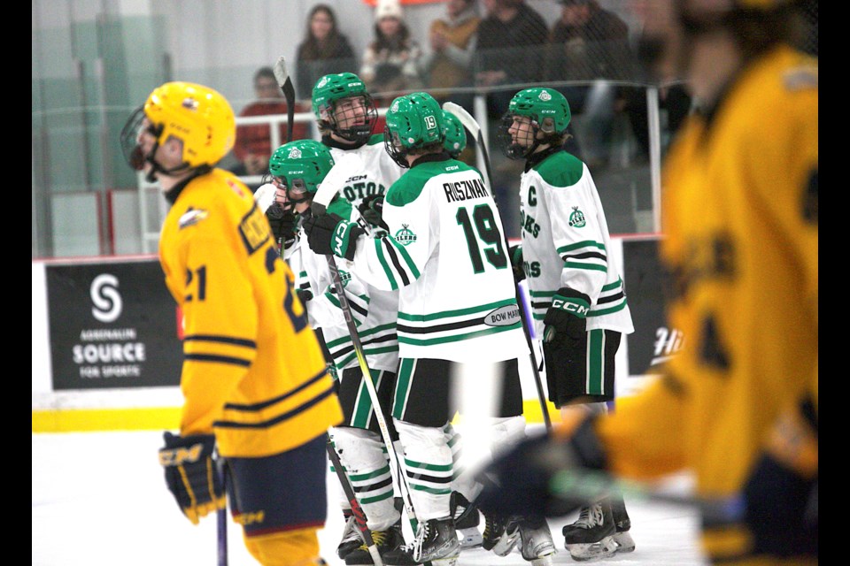 The Okotoks Bow Mark Oilers celebrate their opening goal in the 3-2 win over the Burlington Eagles in the Circle K Classic D Division quarterfinal on Dec. 30 at the Seven Chiefs Sportsplex.