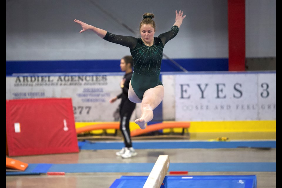 Mountain Shadows gymnast Brooke Spurway leaps during the beam competition at the Mountain Magic Invitational at the Okotoks Recreation Centre on May 4. Spurway took fourth in the all-around and booked her spot on Team Alberta for the upcoming Canadian Gymnastics Championships.