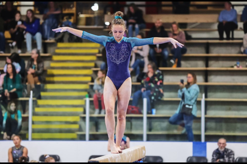 Mountain Shadows gymnast Reece Fischer balances on the beam during the 2023 Mountain Magic Invitational competition. This year’s event has expanded to five days and runs from May 1-5 at the Okotoks Recreation Centre.