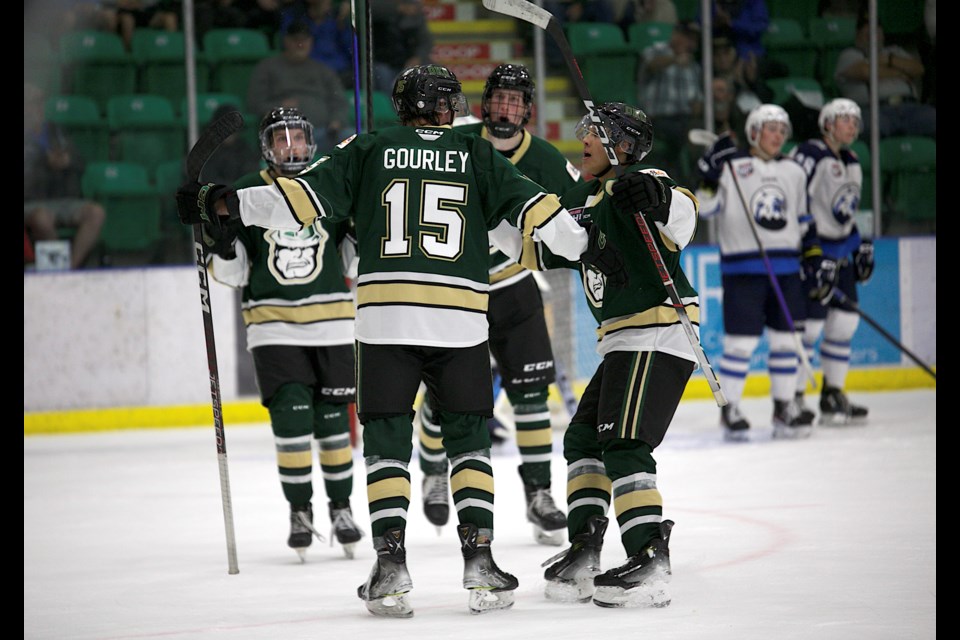 Okotoks Oilers forward Connor Gourley celebrates his second period goal with teammates during the 5-4 shootout victory over the Canmore Eagles in the Oilers home opener on Sept. 16 at Okotoks Centennial Arena.
