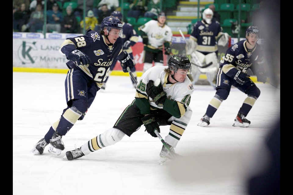 Okotoks Oilers forward Connor Gourley and Spruce Grove Saint Ashton McNelly battle during Game 1 of the BCHL playoff play-in round on April 10 at Okotoks Centennial Arenas. Okotoks won 6-2 to take the 1-0 lead in the best-of-five series. 
