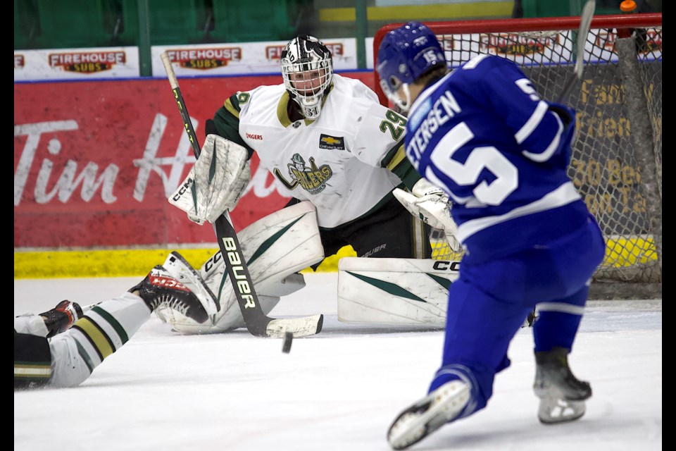 Okotoks Oilers goalie Olivier Ciarlo scrambles back into the net to make a save on Penticton Vees forward Tristan Petersen during Game 4. 
