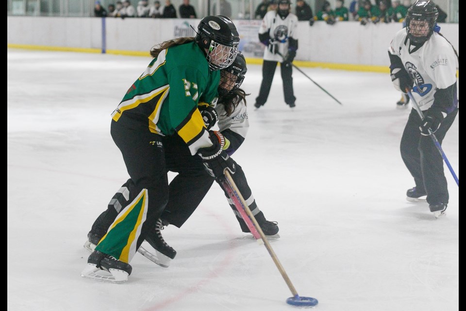 Maddy Rickson of the Foothills Hurricanes U14 C team charges past the Edmonton defence during the Foothills Freeze tournament on Feb. 3 at the Piper Arena. The Hurricanes earned bronze in their division. 