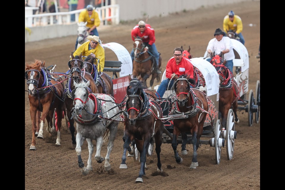 Mark Sutherland (front) screams as he speeds for the finish line in heat four on day one of the Cowboys Rangeland Derby on July 7.