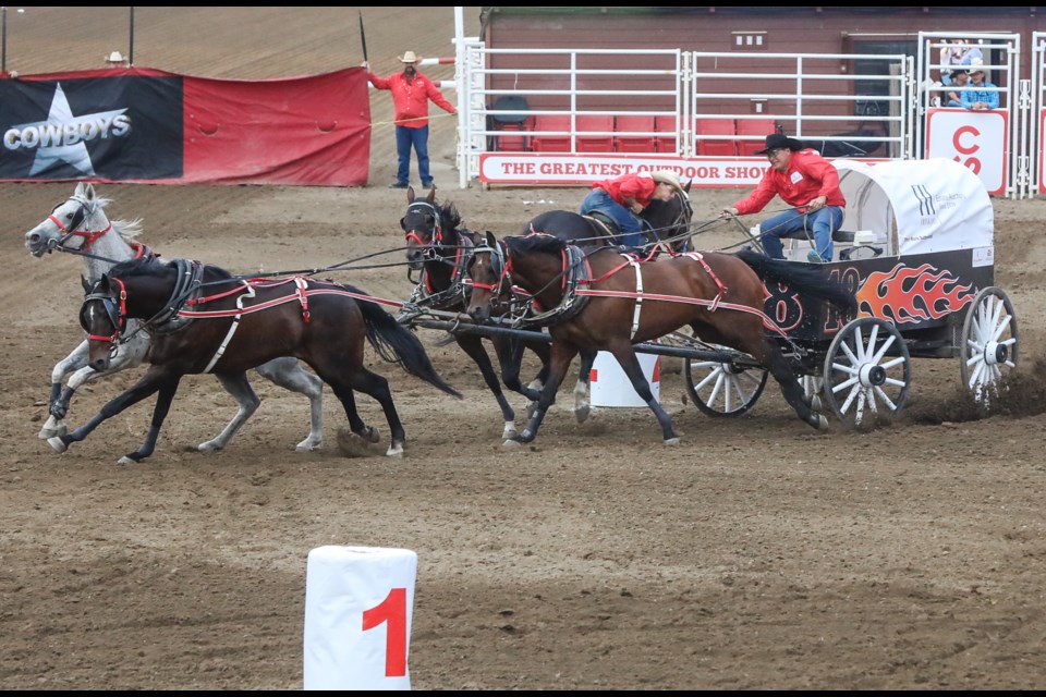 Mark Sutherland rounds the barrels in the start of heat four on day one of the Calgary Stampede Cowboys Rangeland Derby on July 7. Sutherland finished fifth in the aggregate at the event, the final chuckwagon race for the retiring driver. 