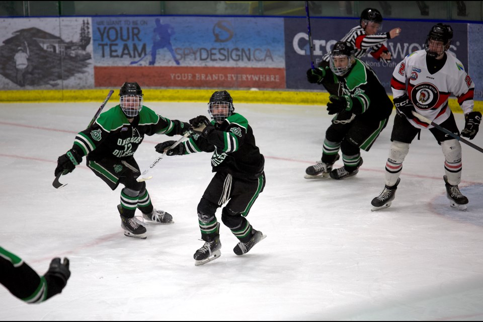 MacLane Tetarenko celebrates his game-winning goal in double overtime with teammates Landon Smith, Cash Colpoys and Kade Pierson as the Okotoks Oilers defeated the Red Deer Chiefs 2-1 in the Hockey Alberta U17 AAA bronze medal game on April 6 at the Viking Rentals Centre. 