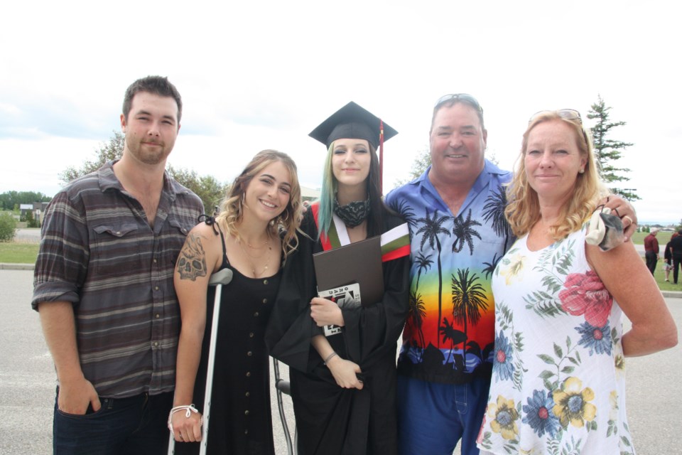 St. Luke's Outreach Centre graduate Taylor Ford poses with, from left, boyfriend Koel Nesimiuk, sister Sharmayne Hallwachs and parents David and Denise Greening during the school's graduation ceremony on June 24 at St. James Parish. (Tammy Rollie/Okotoks Today)