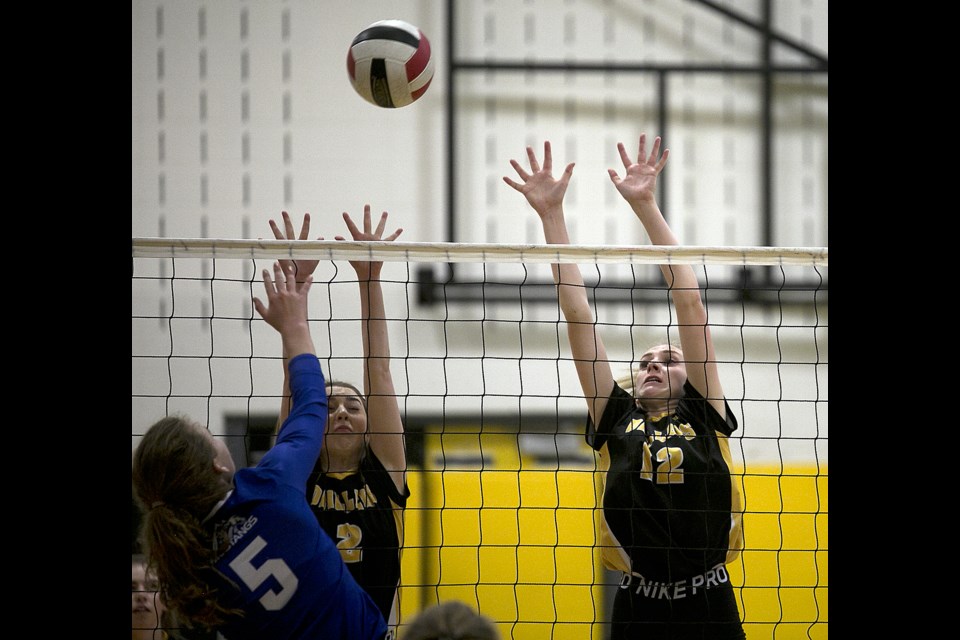 Oilfields Drillers Lesley Chalmers (12) goes up for a block with teammate Jessie White against the Highwood Mustangs on Sept. 25 in Black Diamond. (Bruce Campbell/Western Wheel)