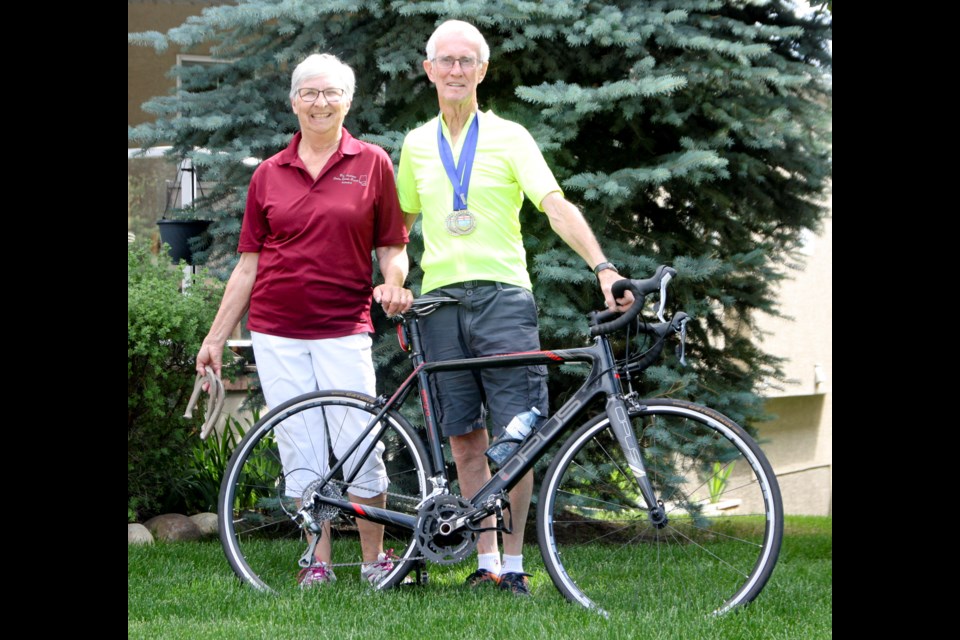 Alberta 55-Plus Games competitors Anne and Bob Wahlund in front of their Okotoks home on July 15.
(Remy Greer/Western Wheel)