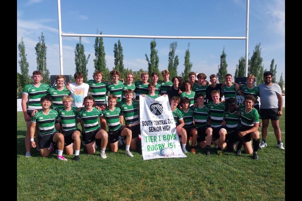 The Holy Trinity Academy Knights pose with the South Central Zone Tier I banner after defeating the Foothills Falcons on June 5 at the Calgary Rugby Union. The Knights will be back at the CRU to compete in the ASAA Provincial Rugby Championships on June 9-10. 