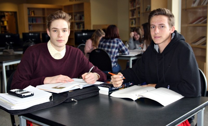 Holy Trinity Academy Grade 12 students Matt Scharien and Jack Morgan, here studying for their Calculus exam, took advantage of extended times for finals last week.