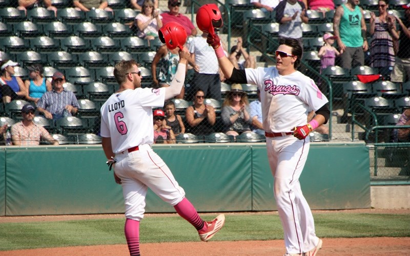 Okotoks Dawgs Rookie of the Year Matt Lloyd and MVP Kody Funderburk celebrate a home run at Seaman Stadium in July. The Dawgs are holding their annual awards and banquet Jan. 