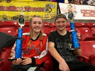 Briony Fokkens and Ryan Mysek proudly display the hardware they won at the Silver Dollar Nationals BMX competition in Las Vegas, Jan. 12-14.