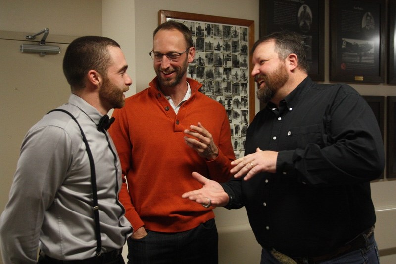 Okotoks Dawgs new head coach Mitch Schmidt, far right, shares a laugh with Academy coach Tyler Hollick, left, and former big leaguer Jim Henderson at the Dawgs Awards Banquet 