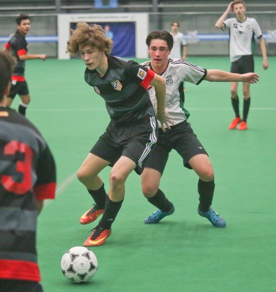 Okotoks United&#8217; s Jerron Conway battles with a Calglen United opponent during U18 boys action at the Anthem United Communities Cup, Jan. 28 at the Crescent Point