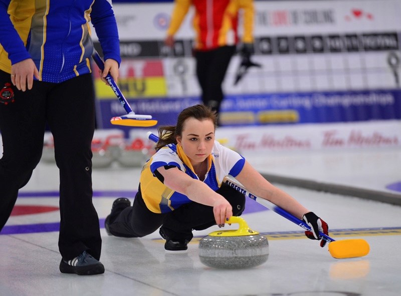 Okotokian and Team Alberta lead Megan Johnson comes out of the hack in round-robin play at the Canadian Junior Women&#8217;s Curling Championships.