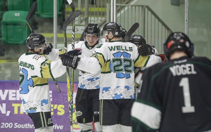 The Okotoks Oilers celebrate Tanner Laderoute&#8217; s game winning goal in the 4-3 victory over the Sherwood Park Crusaders on Feb. 3 at Pason Centennial Arena.