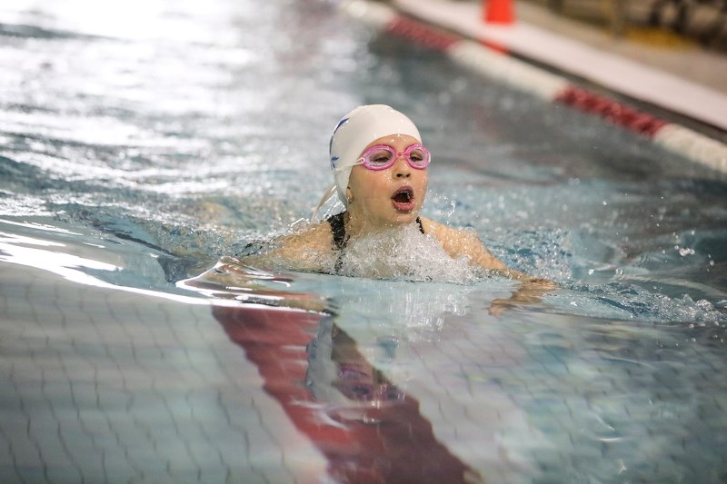 Foothills Stingray Emma Saralegui swims the breaststroke at the Black and Blue Meet held at the Riley Minue Pool on Feb. 3.