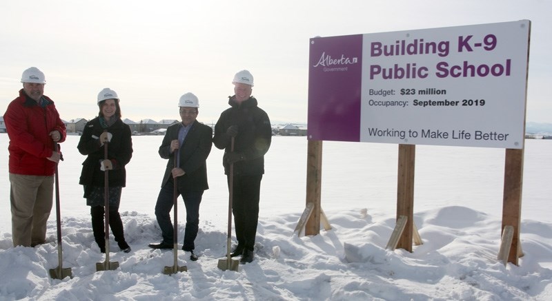 The official ground-breaking for the Foothills School Division&#8217; s new K-Grade 9 school was held Feb. 6 along 32 Street across from Holy Trinity Academy. Digging are