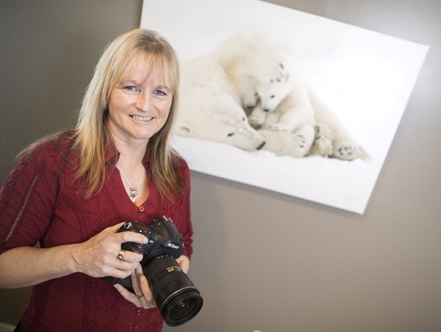 Award-winning photographer Debra Garside had this photograph of a polar bear lounging with her cubs place in the top five for the Natural History Museum of London&#8217; s