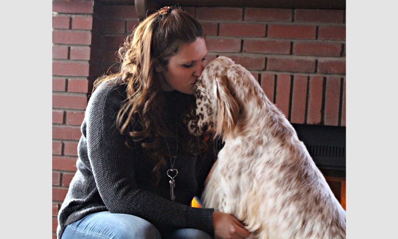 Sabrina Oakes shares a moment with Penny, an English setter. The pair recently competed in the Westminster Kennel Club Dog Show in New York City. Penny received an award of