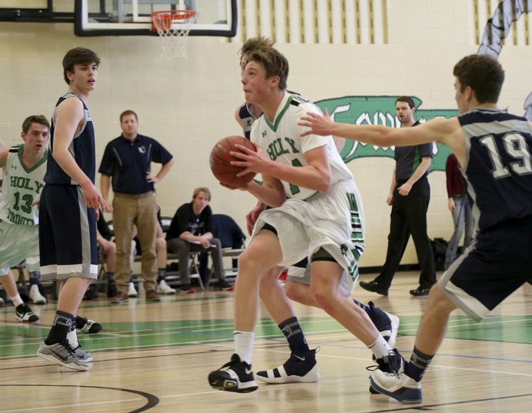 Holy Trinity Academy Knights forward Carson McKenzie drives the lane during the 84-48 victory over Notre Dame Collegiate in the FAC senior boys championship on March 3.