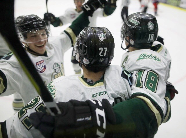 Okotoks Oiler Marc Pasemko gets mobbed by teammates after his first period goal in the team&#8217;s 4-3 victory over the Brooks Bandits in Game 5 of the AJHL South Final,