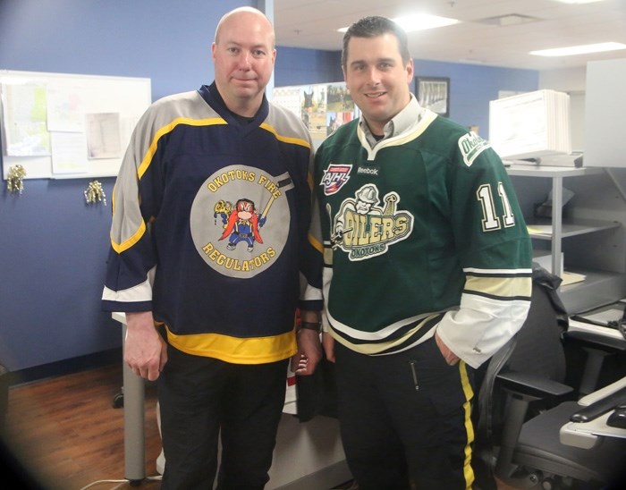 Okotoks deputy fire chief Dwight Seymour and Okotoks Const. Kurt Thomas will square off in the Battle of the Badges charity hockey game on April 23 at Pason Centennial Arena. 