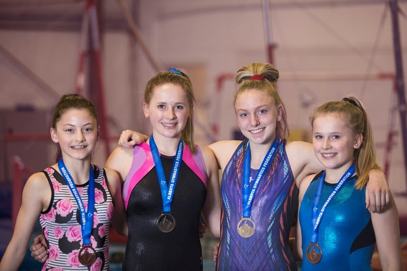 Mountain Shadows Gymnastics Club members had a strong showing in provincials recently winning three medals. From left are Mia Dionne, Callie Zacharias, Rebecca Lane and Lexie 
