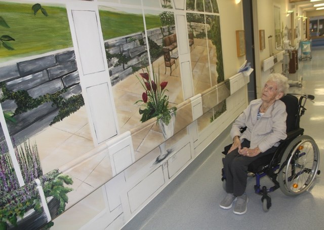 Rising Sun Long Term Care patient Ruth Howard looks at one of her favourirte murals in the Black Diamond facility. The murals are part of a project funded by the Sheep River