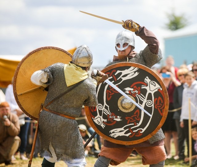 Nick Goetz and Christian Arel clash swords on the &#8220;battlefield&#8221; in the Viking Village at Chinook Honey&#8217;s Horde at the Hive event last year. This