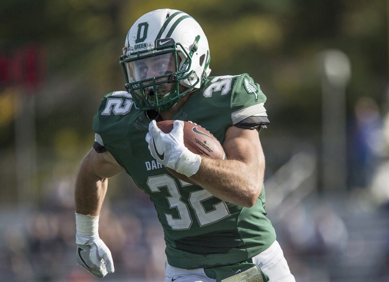 Former Holy Trinity Academy Knight runningback Ryder Stone, here running for the Dartmouth Big Green, was selected by the Montreal Alouettes in the CFL draft on May 3.
