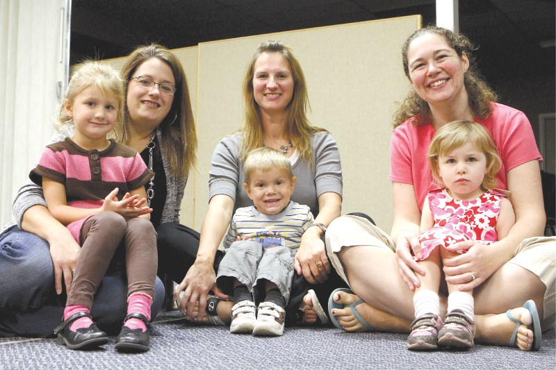 Theresa Zubot with her daughter Rylee, Candace Grenkow, and son Tyler and Heather Zabawski and daughter Laura pose for a photo at the Living Springs Church which hosts the