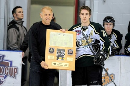 Okotoks Oiler Kyle Reynolds is presented with a plaque commemorating his 68th goal as an Oiler setting a new club record.