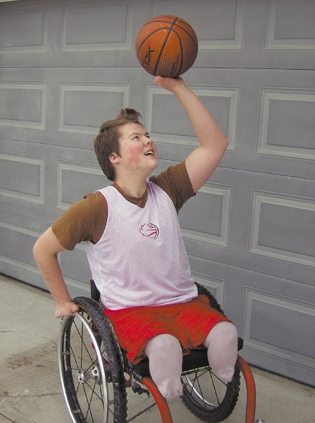 Zak Madell demonstrates his basketball form at his Okotoks home. The 16-year-old received a CHAMP Ambassador Certificate from the War Amps for mentoring younger child