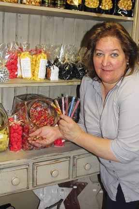 Monika McLachlan of All Through the House shows some of the candy once called penny sticks. The federal government is contemplating eliminating the penny from circulation.