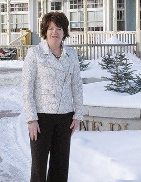 Bev Carlson, president of the Okotoks and District Chamber of Commerce, will continue in the position for another year after the group&#8217;s annual general meeting on Jan.