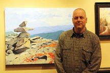 Posing with with his work Vantage Point, Glynn Anderson is an Okotoks artist who has long promoted art as a means to encouraging troubled youth. In addition to his painting,