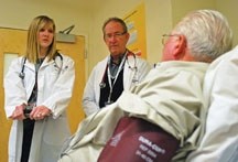 High River resident Eldon Couey is treated by Dr. Nicole Roper and Dr. Ron Gorsche at the High River General Hospital. Dr. Roper is one of three new doctors who will set up