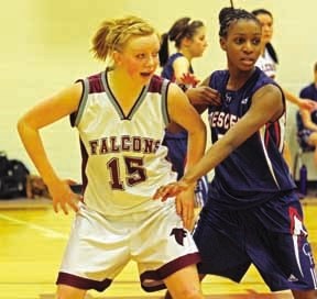Foothills Composite forward Amy Woolridge (left) posts up against a Crescent Heights forward during the Falcons&#8217; 70-64 loss in the 2011 Falcons Classic at Foothills