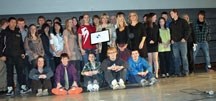 Dr. Michele Jacobsen of the Canadian Education Association presents the Ken Spencer Award to Oilfields High School Quest students on Feb. 3 at the school. The program was