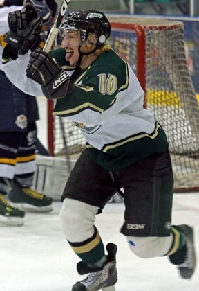 Oiler Alex Kromm celebrates a third-period goal against his former club during Okotoks&#8217; 7-1 victory over the Calgary Mustangs on Sunday at the Centennial Arena.