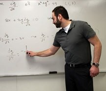 Foothills Composite math teacher Chris Ginakos teaches calculus in Math 31 on March 3. He will be teaching the Advanced Placement mathematics program when it introduced to