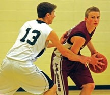 Foothills&#8217; Tyler Grigor (right) is guarded by HTA&#8217;s James LaGrange (left) during the Falcons&#8217; 63-61 FAC title victory at Holy Trinity Academy on Saturday.